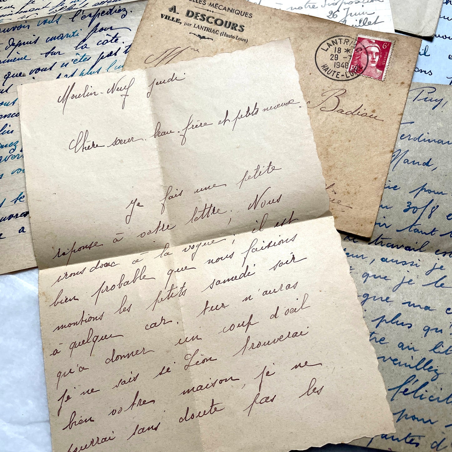 Five handwritten French letters from the 1940s with original envelopes and postage stamps, featuring vintage paper.