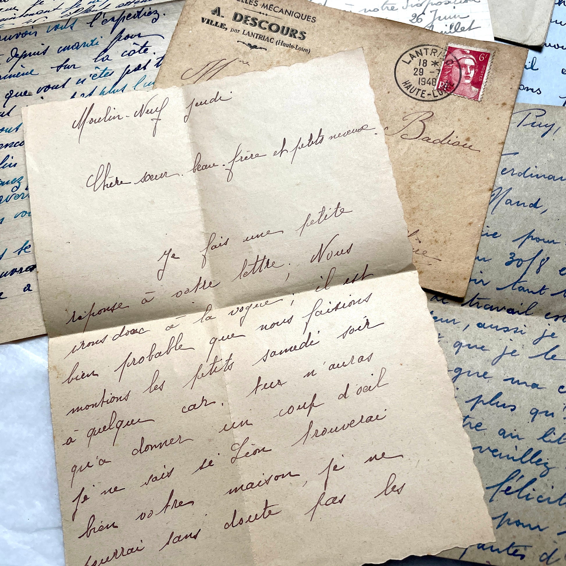 Five handwritten French letters from the 1940s with original envelopes and postage stamps, featuring vintage paper.