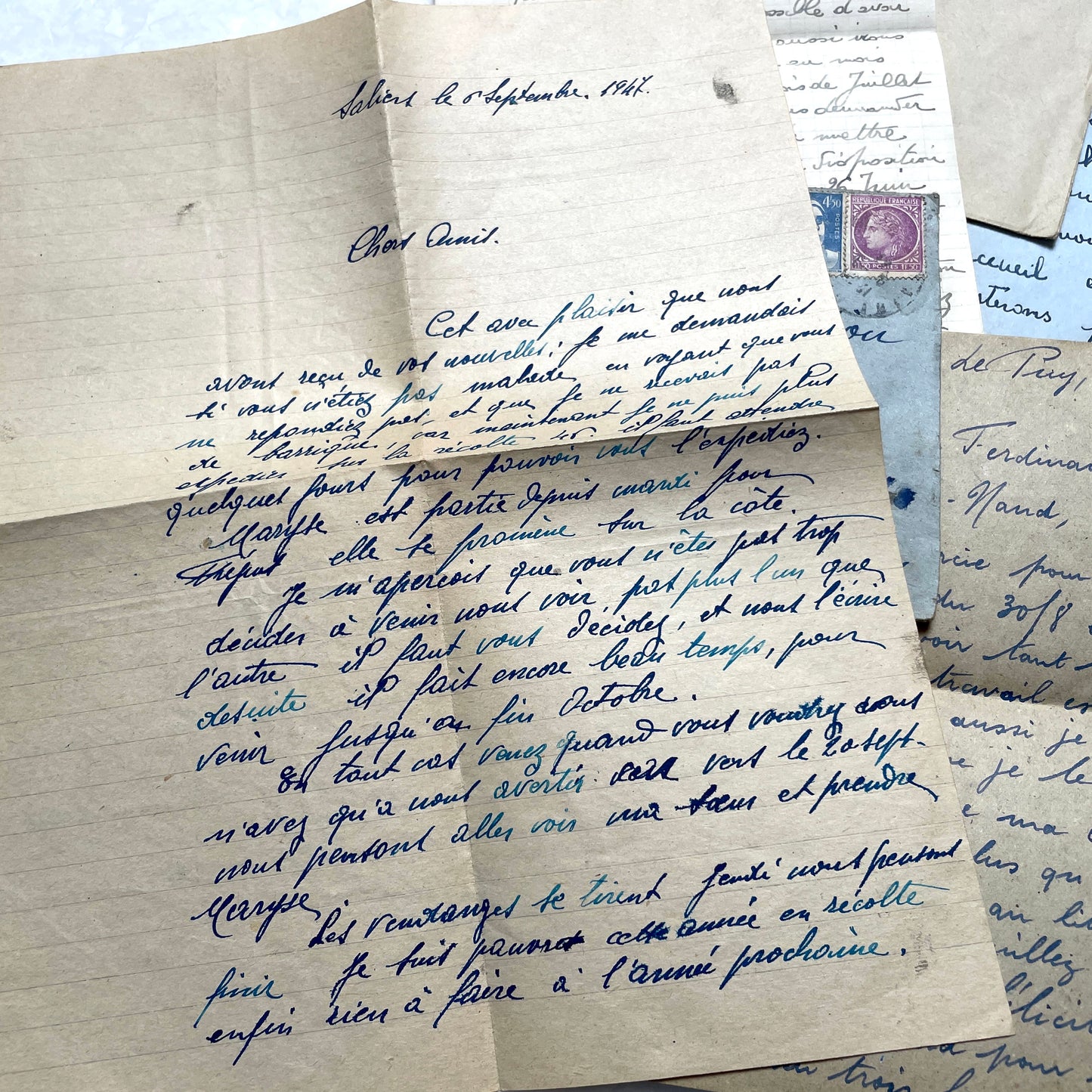 Five handwritten French letters from the 1940s with original envelopes and postage stamps, featuring vintage paper.