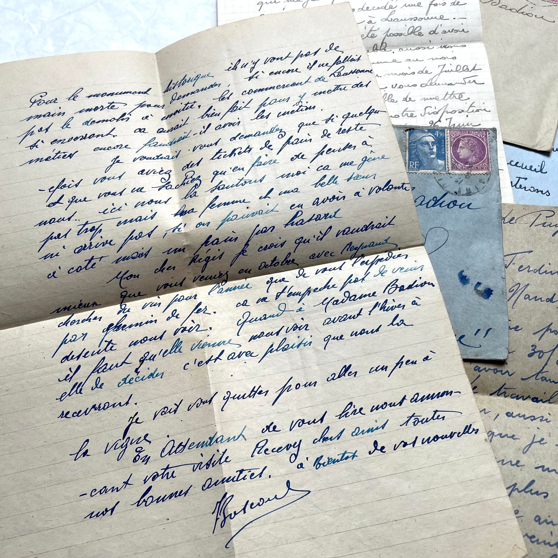 Five handwritten French letters from the 1940s with original envelopes and postage stamps, featuring vintage paper.