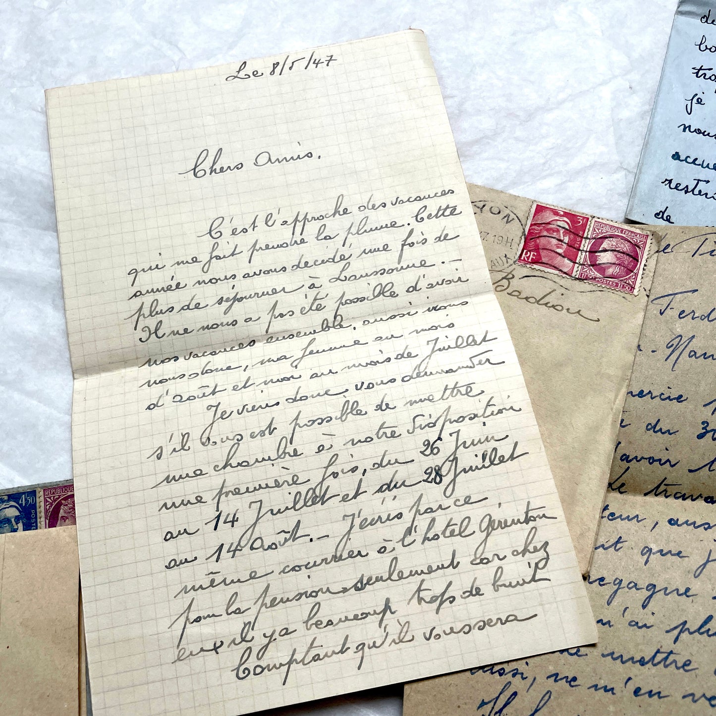 Five handwritten French letters from the 1940s with original envelopes and postage stamps, featuring vintage paper.