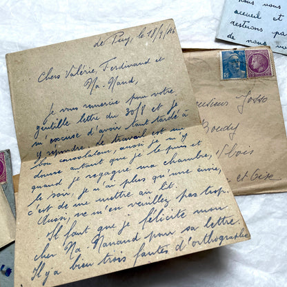 Five handwritten French letters from the 1940s with original envelopes and postage stamps, featuring vintage paper.
