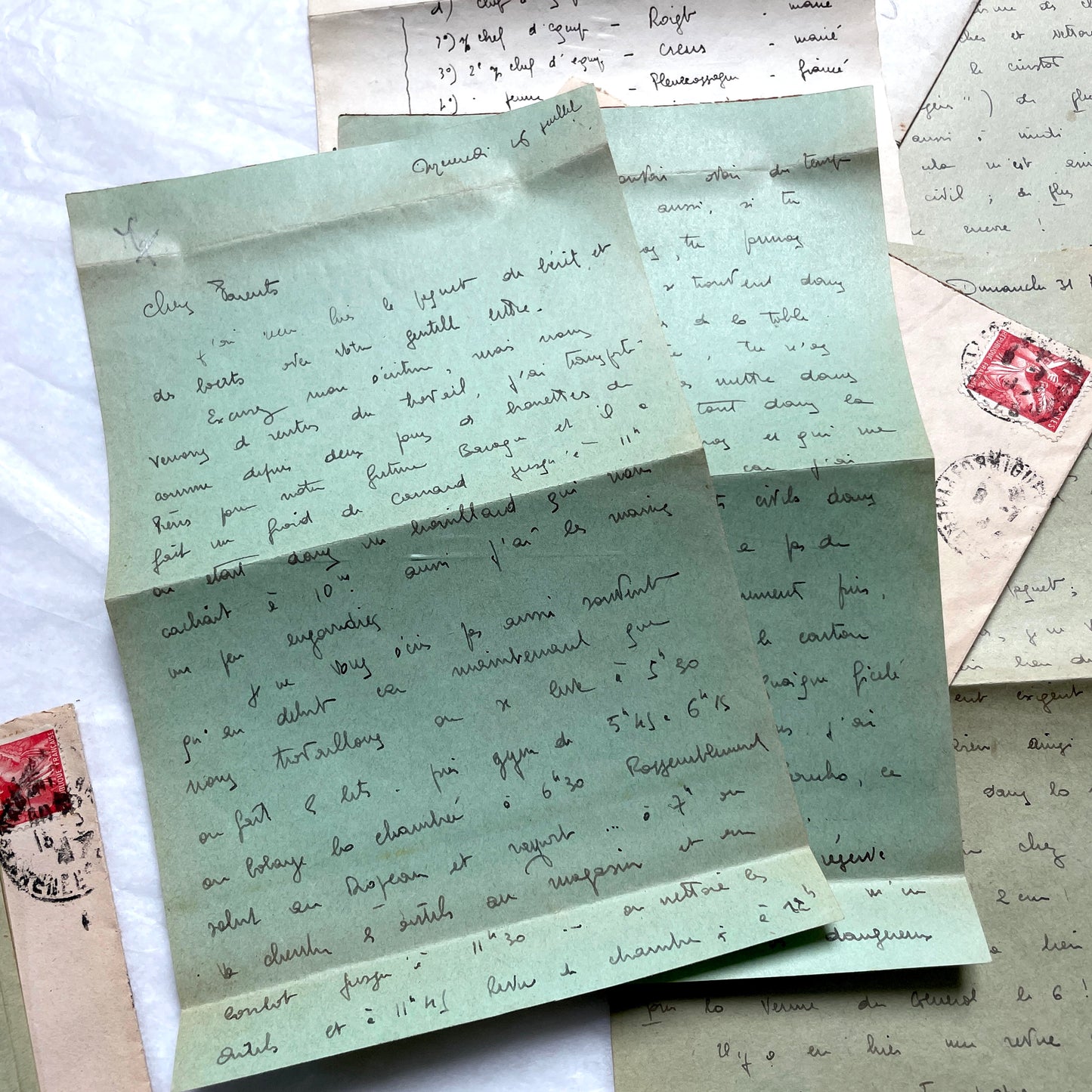1930s French handwritten letters set with envelopes, showing cursive script, postage stamps, and postmarks.
