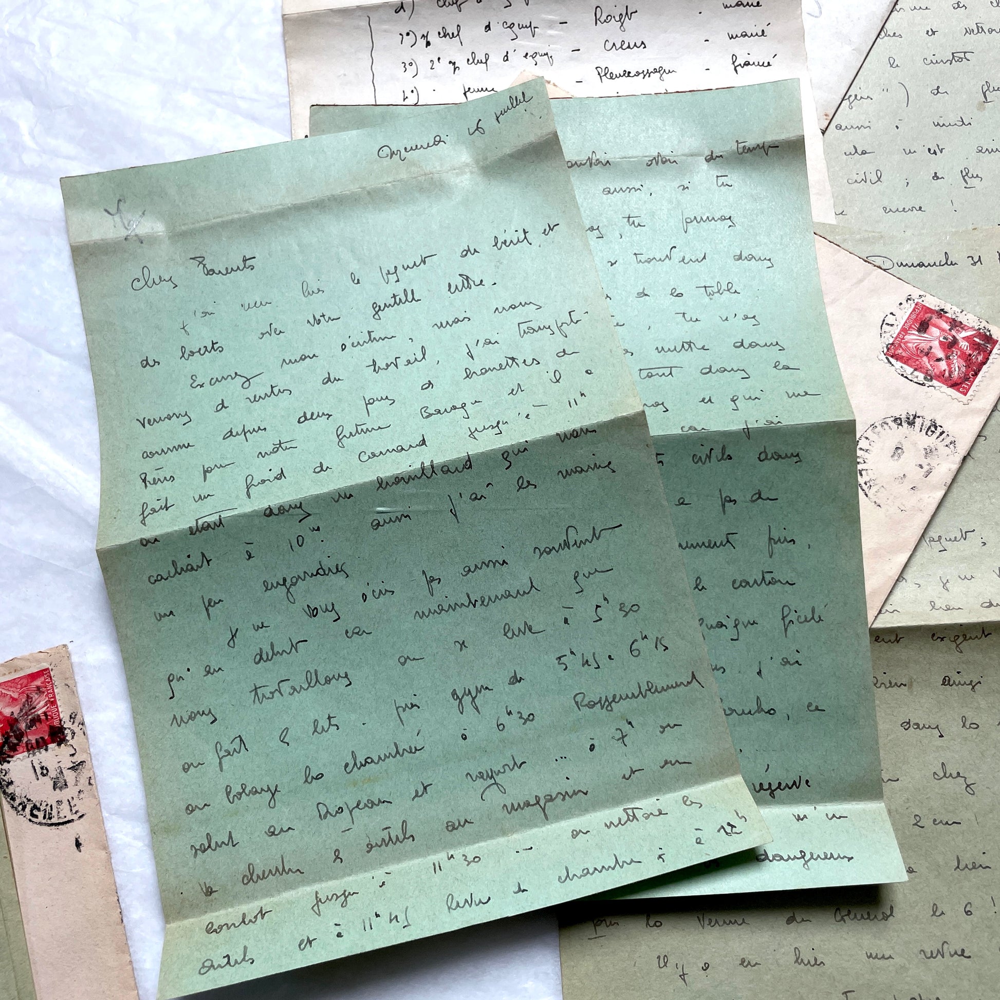 1930s French handwritten letters set with envelopes, showing cursive script, postage stamps, and postmarks.
