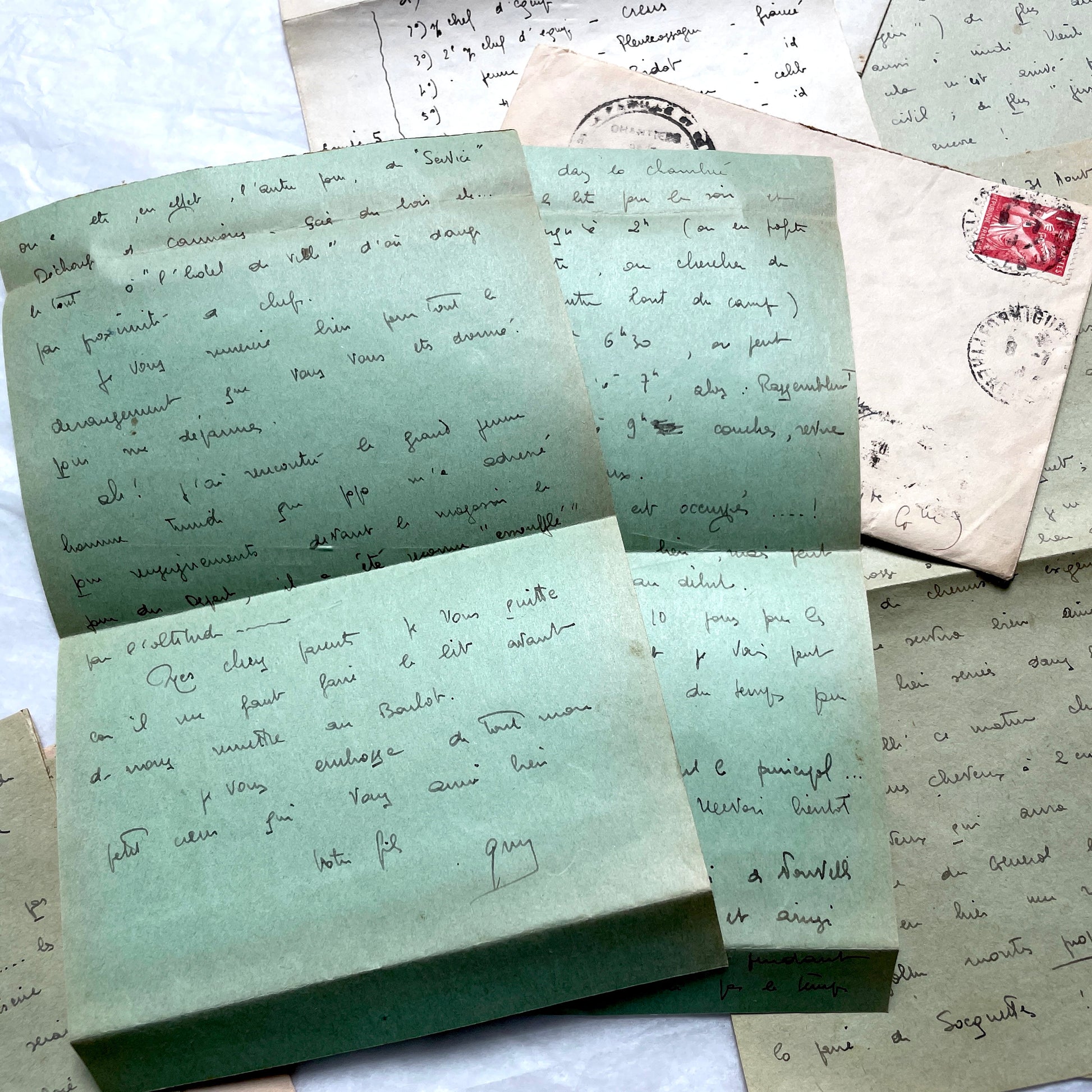 1930s French handwritten letters set with envelopes, showing cursive script, postage stamps, and postmarks.