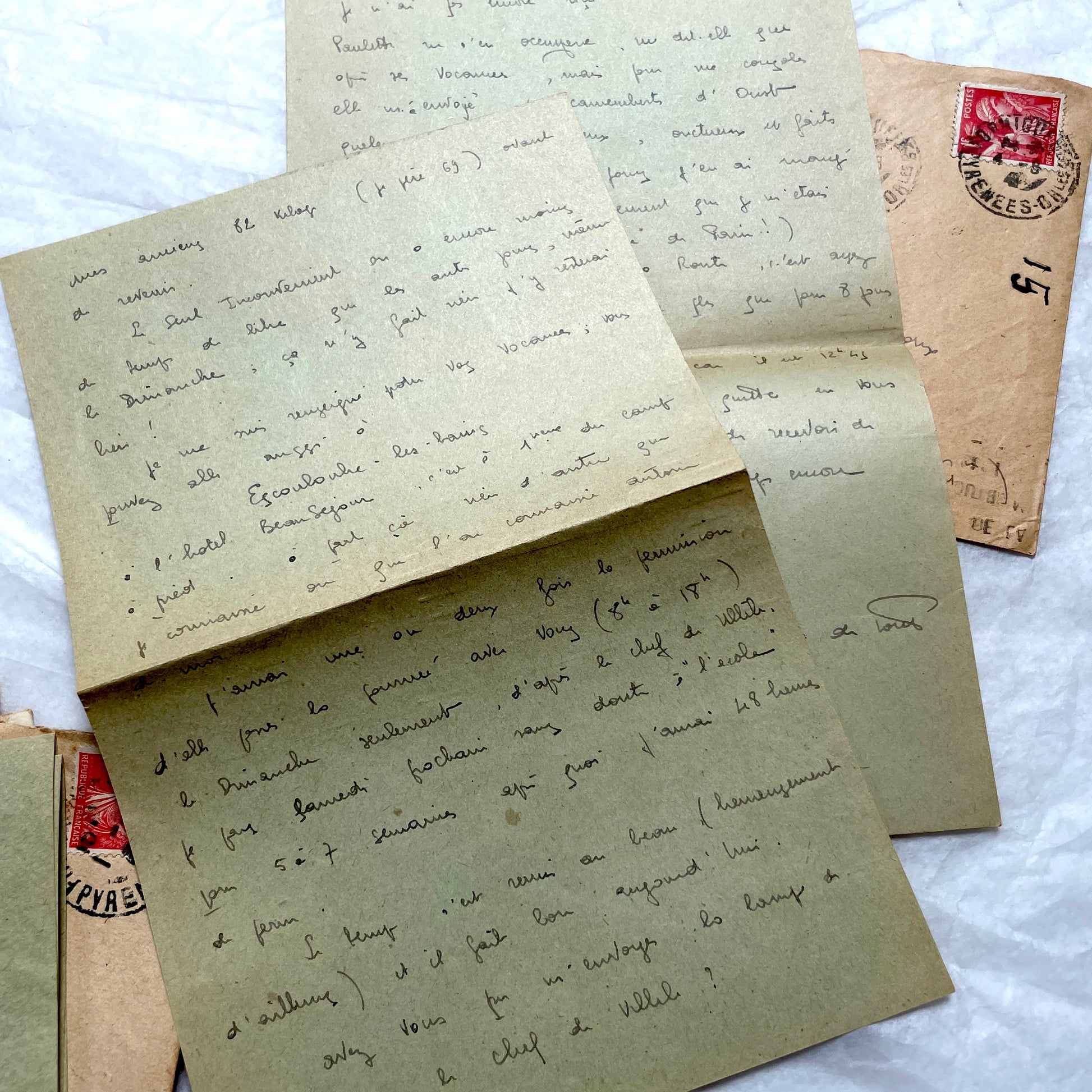 1930s French handwritten letters set with envelopes, showing cursive script, postage stamps, and postmarks.