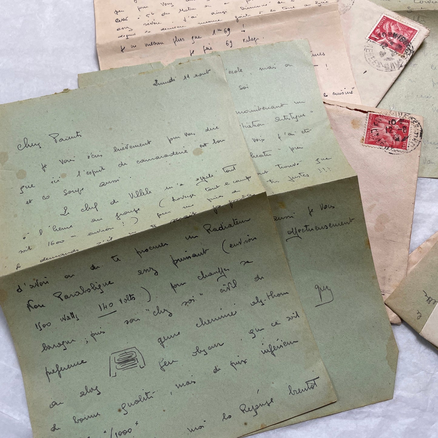 Five French handwritten letters and envelopes from the 1940s, featuring period postage stamps and script.