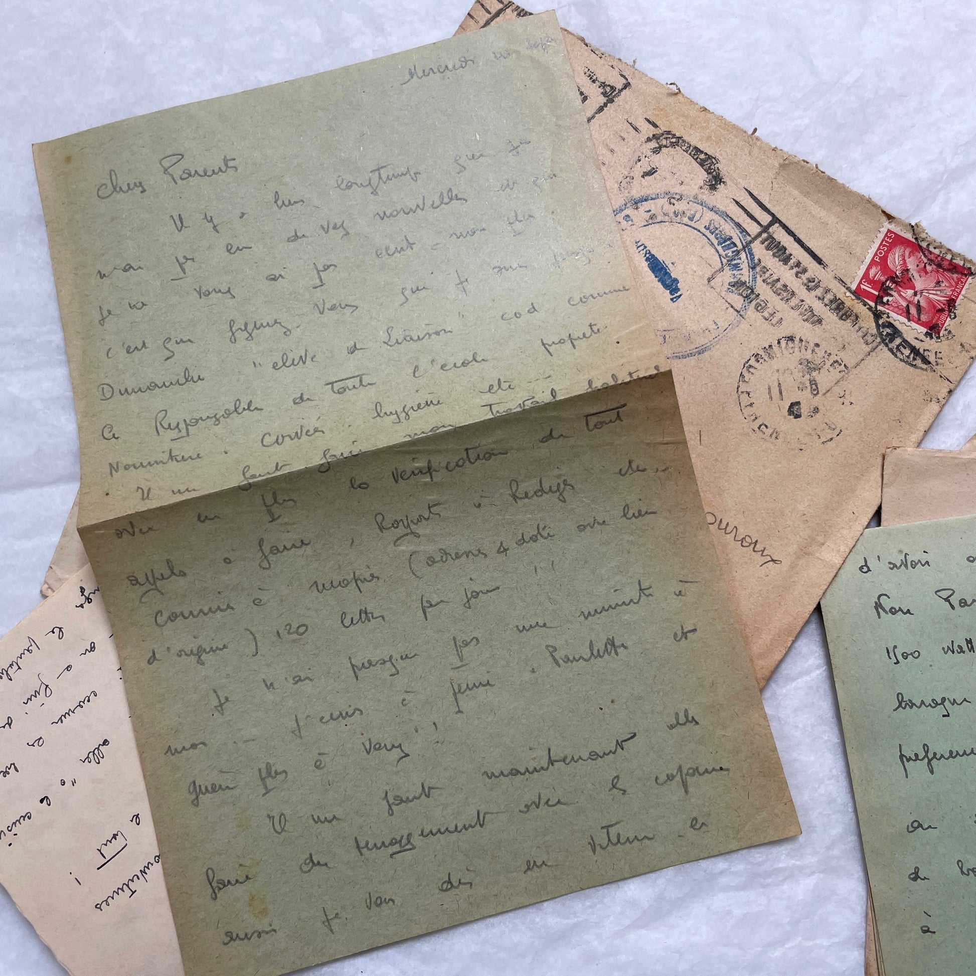 Five French handwritten letters and envelopes from the 1940s, featuring period postage stamps and script.