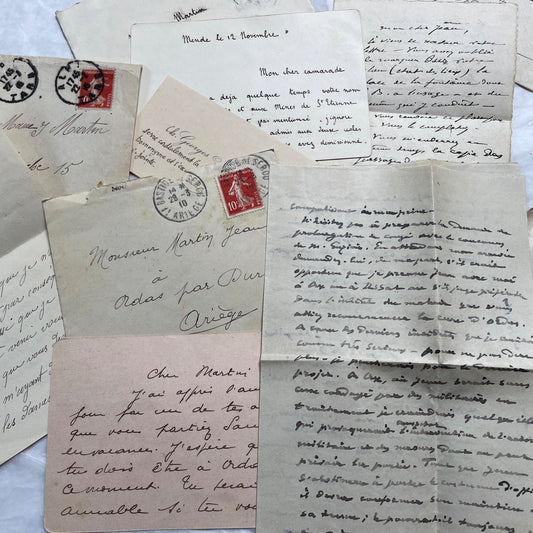 Set of 1910s French letters with envelopes, featuring handwritten script, postage stamps, and postmarks.
