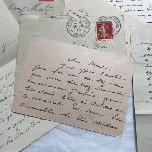 Set of 1910s French letters with envelopes, featuring handwritten script, postage stamps, and postmarks.