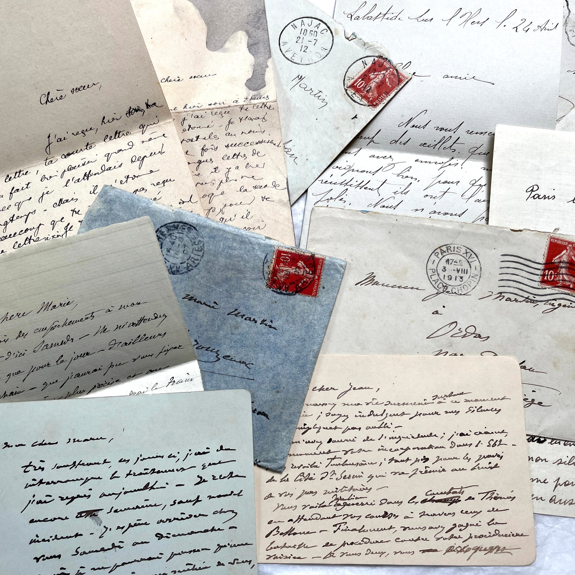 1910s vintage French letters and envelopes lot, featuring handwritten script, antique stamps, and historical postmarks.