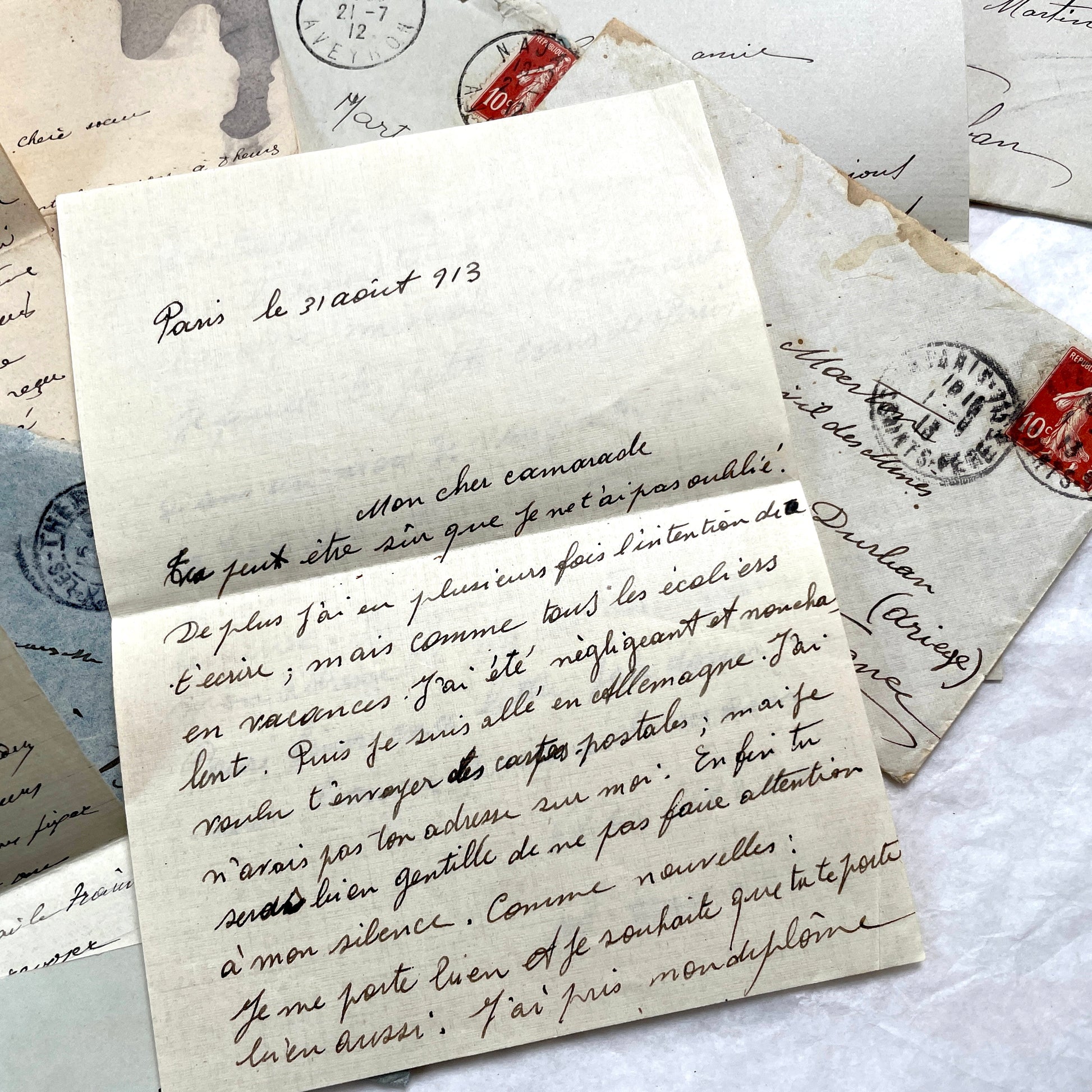 1910s vintage French letters and envelopes lot, featuring handwritten script, antique stamps, and historical postmarks.