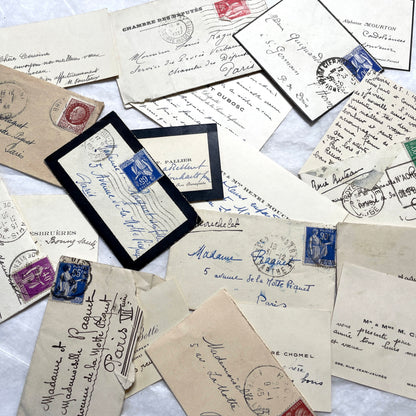 Lot of 10 French 1930s miniature envelopes with handwritten notes, business cards, and vintage stamps.