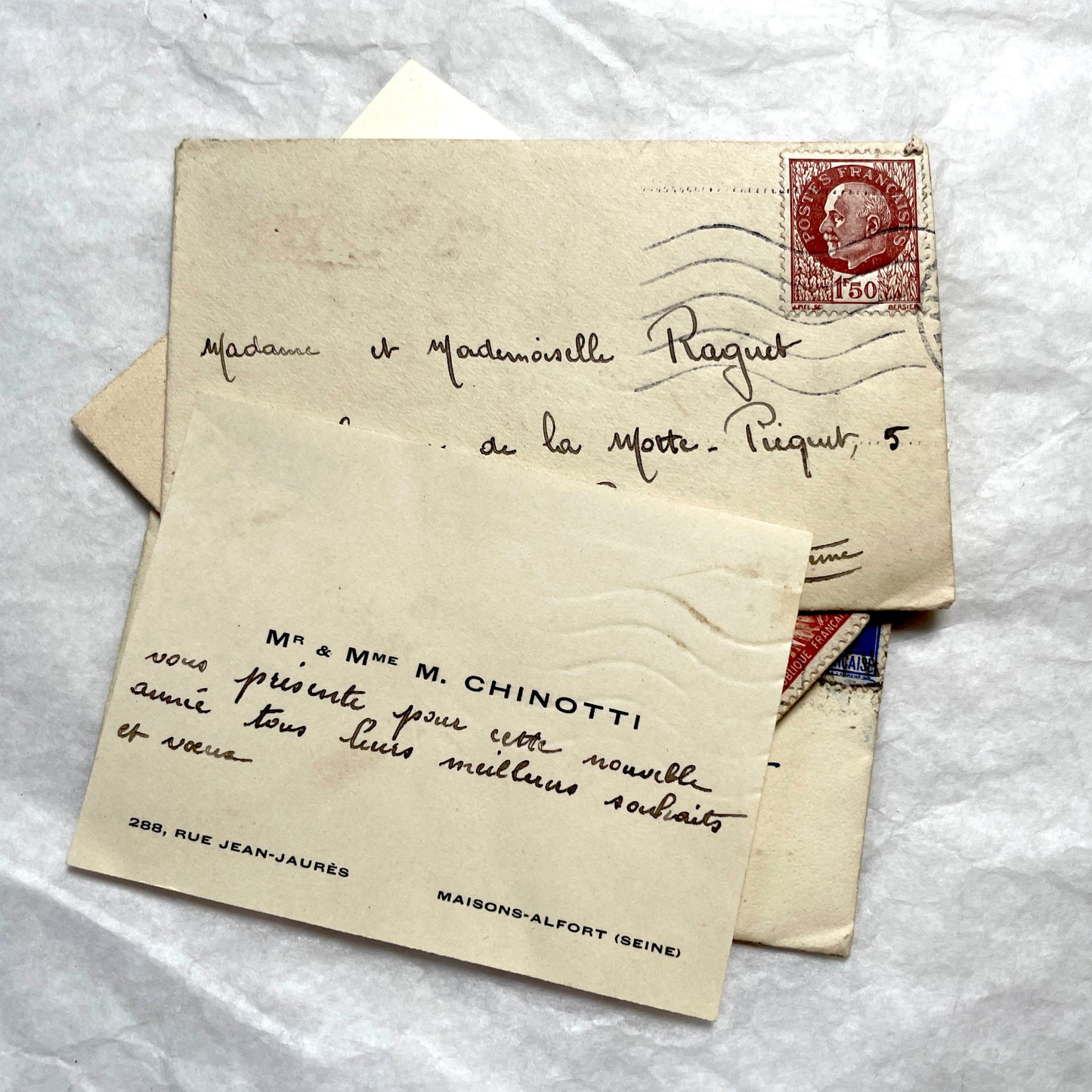 Lot of 10 French 1930s miniature envelopes with handwritten notes, business cards, and vintage stamps.