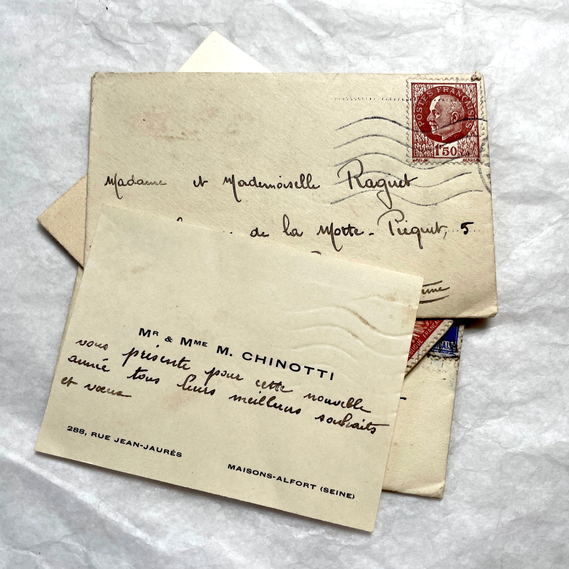 Lot of 10 French 1930s miniature envelopes with handwritten notes, business cards, and vintage stamps.