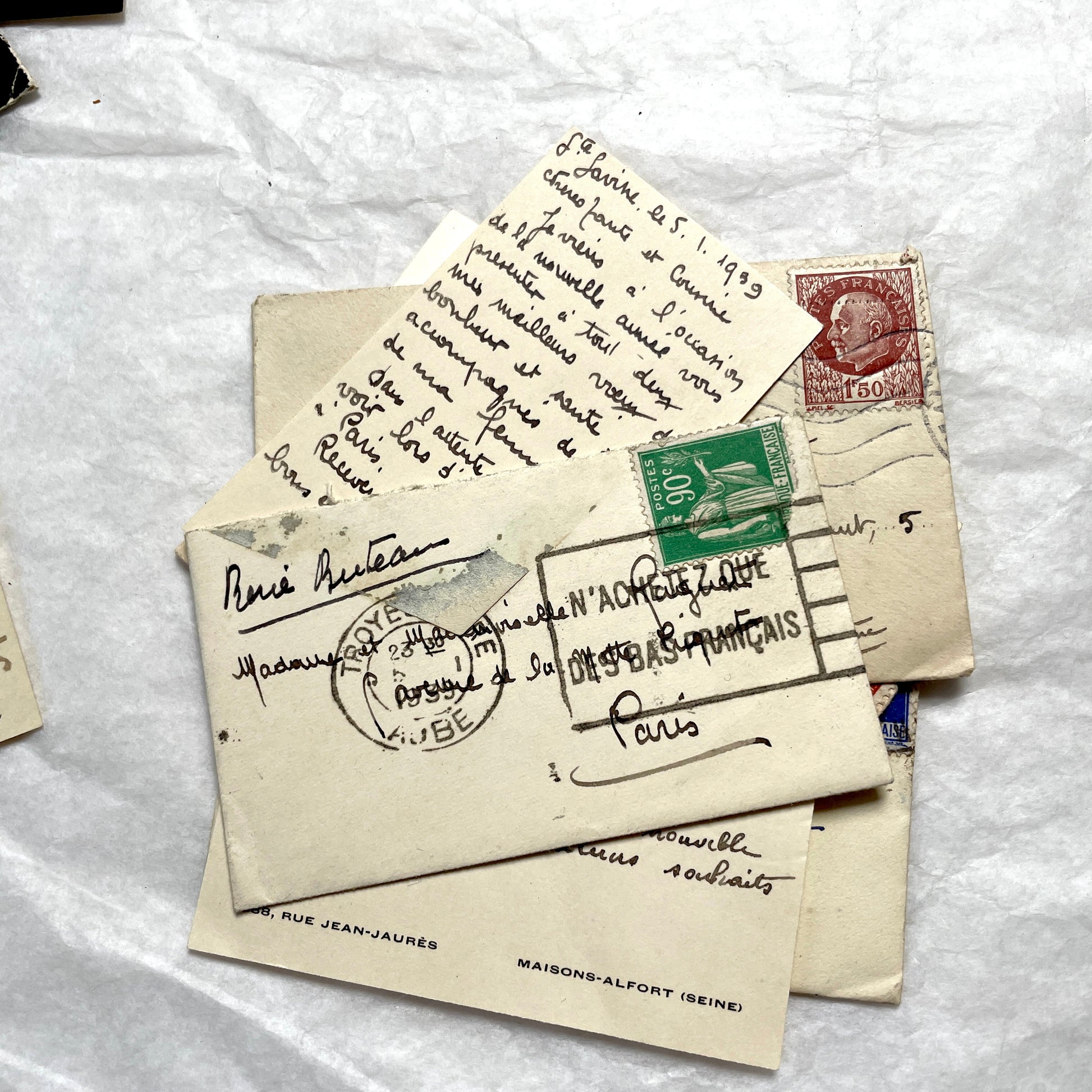 Lot of 10 French 1930s miniature envelopes with handwritten notes, business cards, and vintage stamps.
