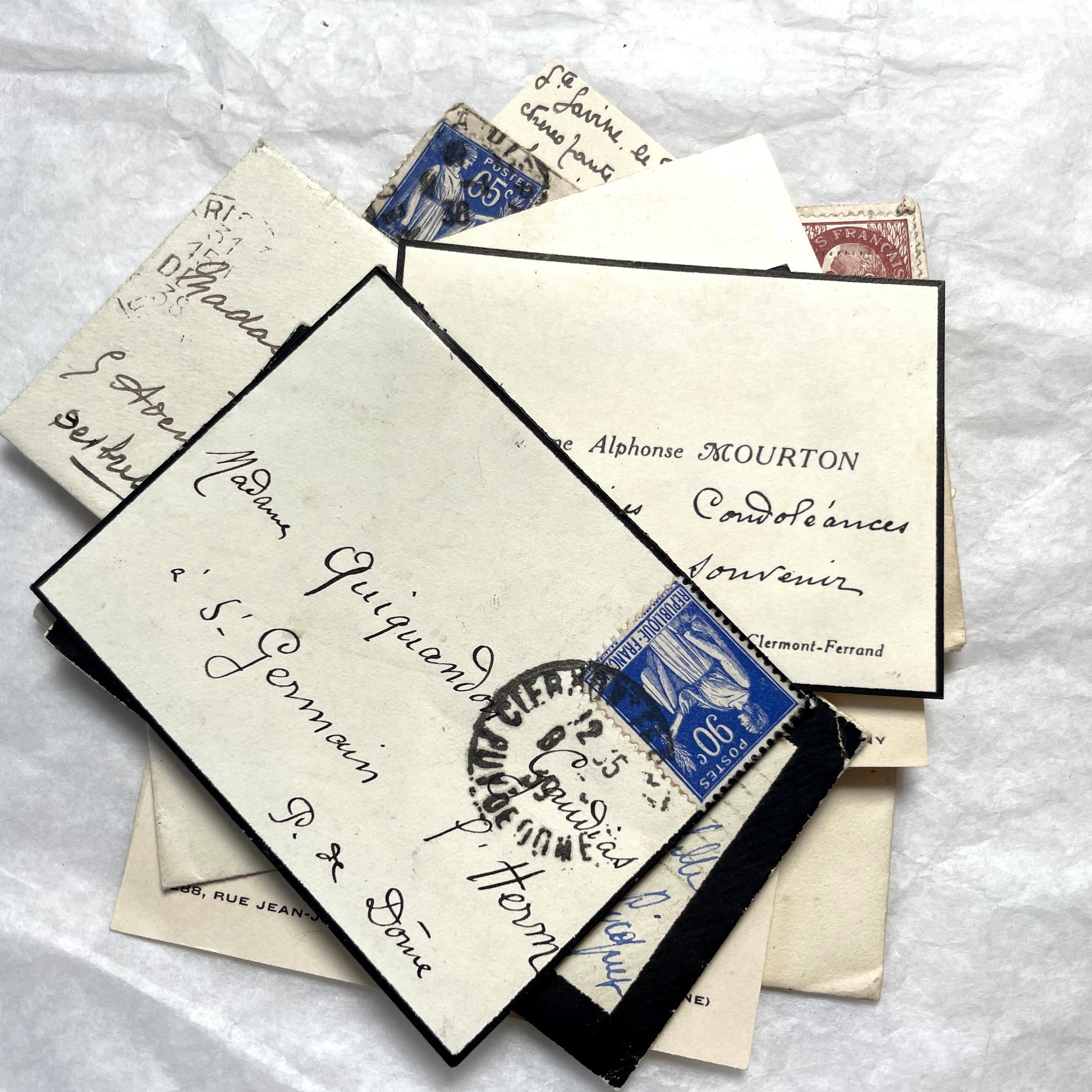 Lot of 10 French 1930s miniature envelopes with handwritten notes, business cards, and vintage stamps.