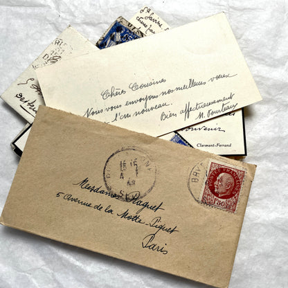Lot of 10 French 1930s miniature envelopes with handwritten notes, business cards, and vintage stamps.