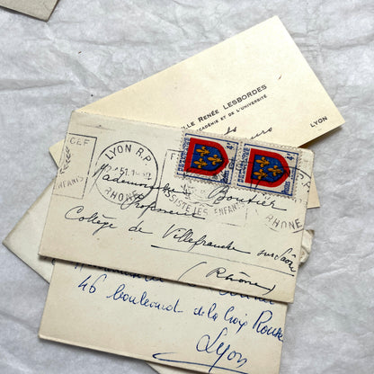 Lot of 10 1950s French ephemera small envelopes with handwritten notes, stamps, and postmarks.