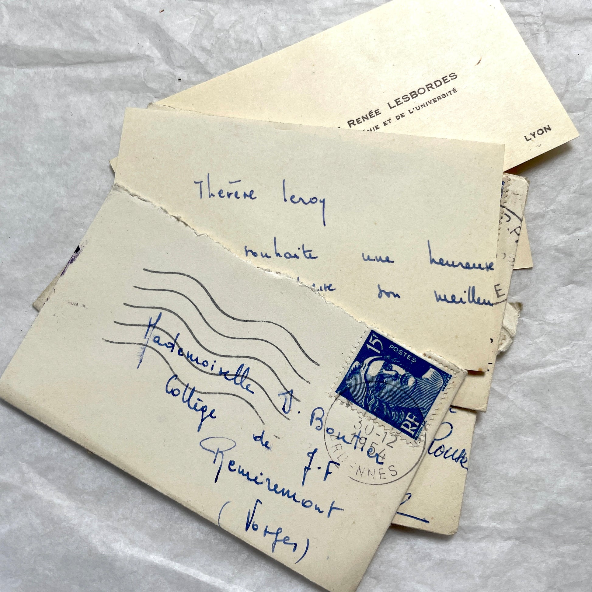 Lot of 10 1950s French ephemera small envelopes with handwritten notes, stamps, and postmarks.