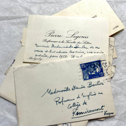 Lot of 10 1950s French ephemera small envelopes with handwritten notes, stamps, and postmarks.