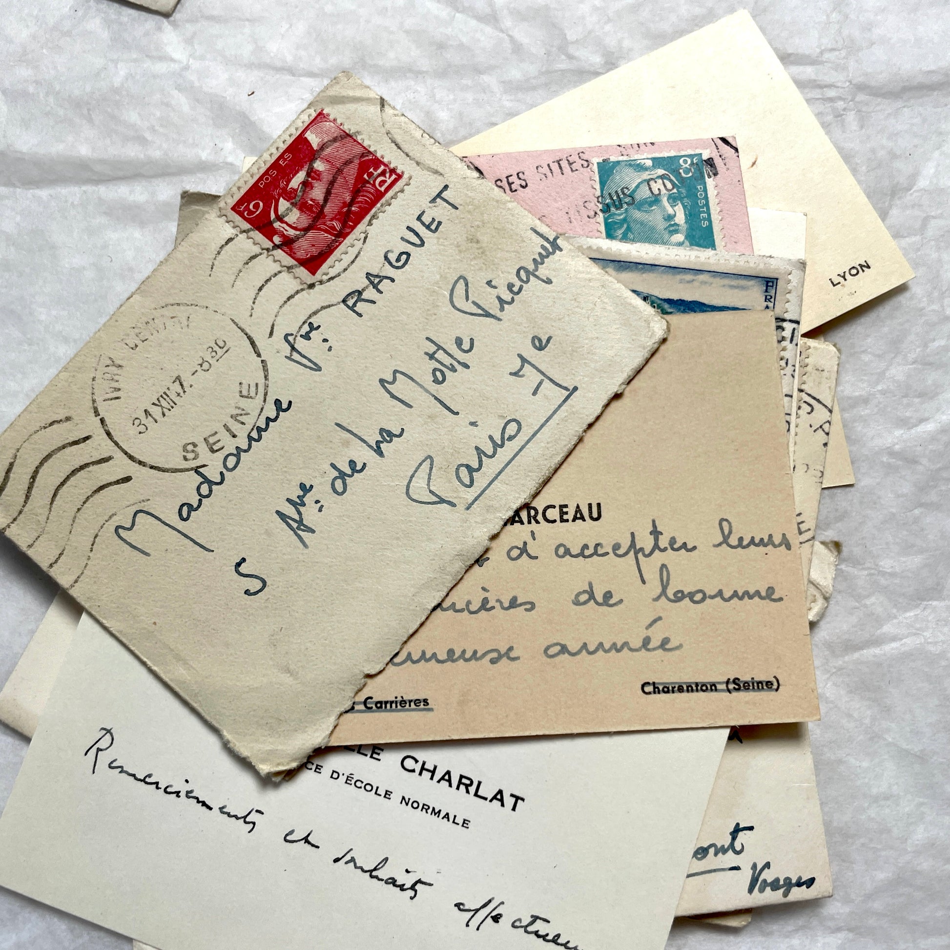 Lot of 10 1950s French ephemera small envelopes with handwritten notes, stamps, and postmarks.