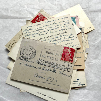 Lot of 10 1950s French ephemera small envelopes with handwritten notes, stamps, and postmarks.