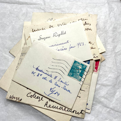 1950s vintage French envelopes lot with handwritten notes, old stamps, and historical postmarks from France.