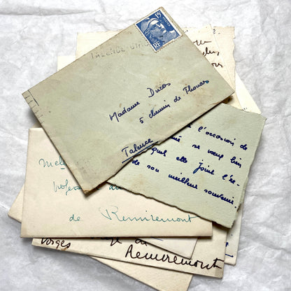 1950s vintage French envelopes lot with handwritten notes, old stamps, and historical postmarks from France.