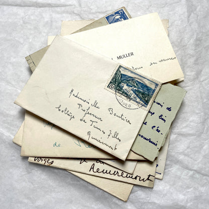 1950s vintage French envelopes lot with handwritten notes, old stamps, and historical postmarks from France.