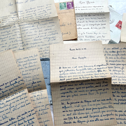 Set of 1940s French handwritten letters with original envelopes and stamps, showcasing vintage European correspondence.
