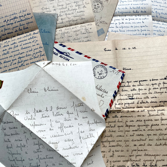 Set of 1940s French letters with envelopes, featuring handwritten notes, airmail, and postmarks.