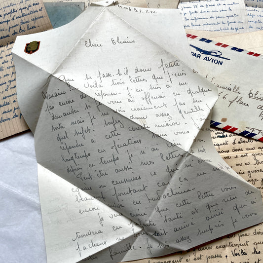 Set of 1940s French letters with envelopes, featuring handwritten notes, airmail, and postmarks.