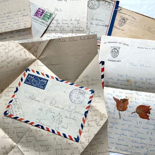 Set of 1940s French letters and envelopes, featuring handwritten notes, postal stamps, and vintage airmail details.