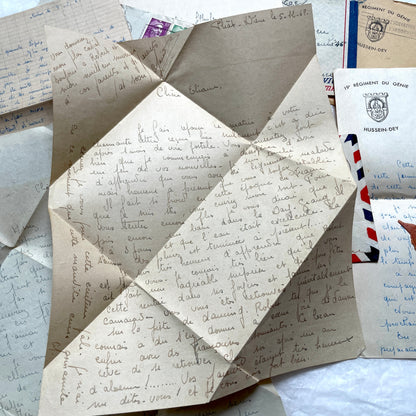 Set of 1940s French letters and envelopes, featuring handwritten notes, postal stamps, and vintage airmail details.
