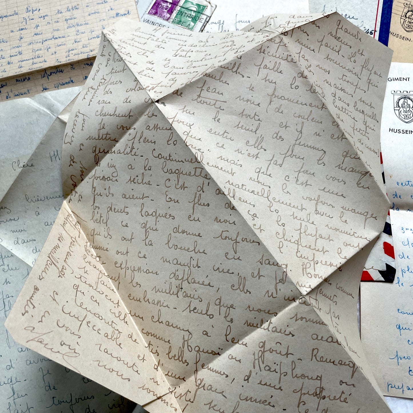 Set of 1940s French letters and envelopes, featuring handwritten notes, postal stamps, and vintage airmail details.