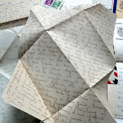 Set of 1940s French letters and envelopes, featuring handwritten notes, postal stamps, and vintage airmail details.