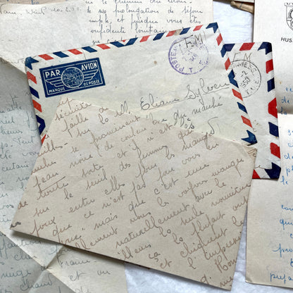 Set of 1940s French letters and envelopes, featuring handwritten notes, postal stamps, and vintage airmail details.