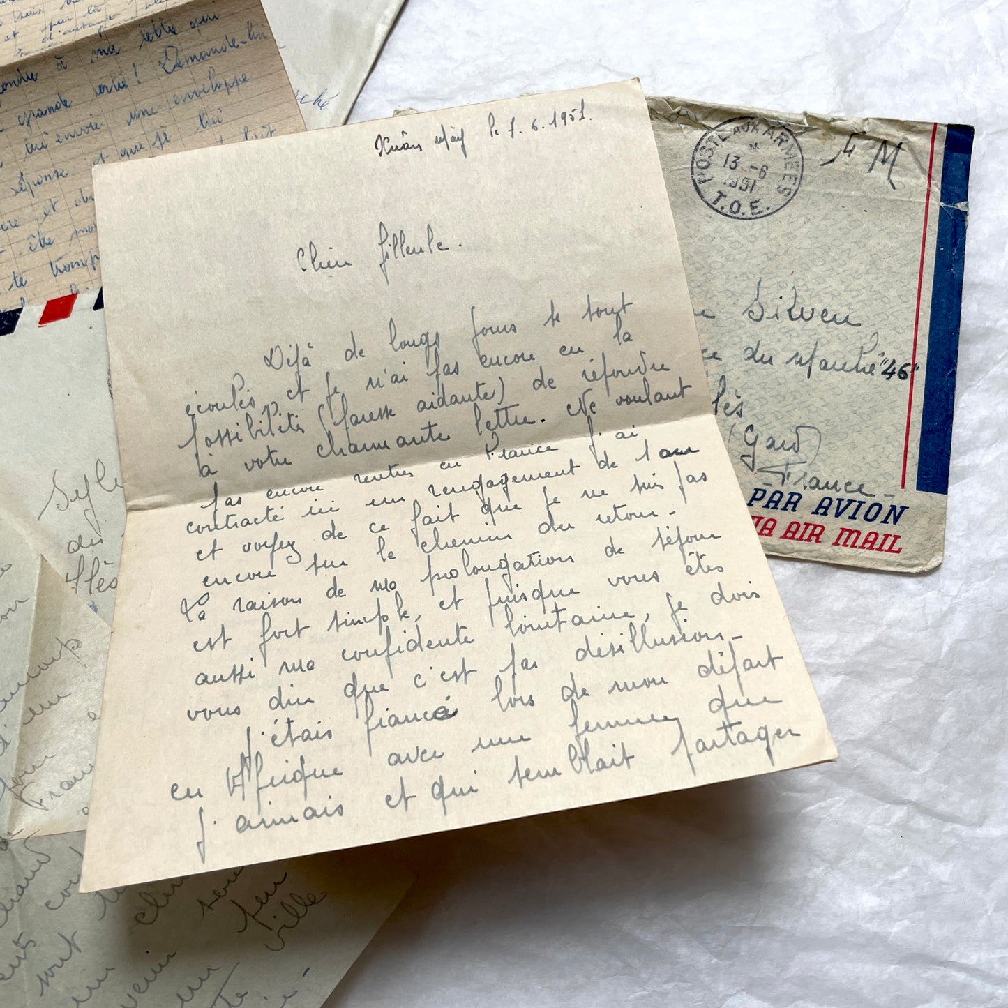 Set of 1940s French letters and envelopes, featuring handwritten notes, postal stamps, and vintage airmail details.