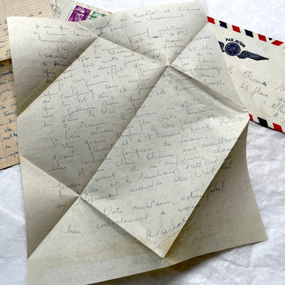 Set of 1940s French letters and envelopes, featuring handwritten notes, postal stamps, and vintage airmail details.