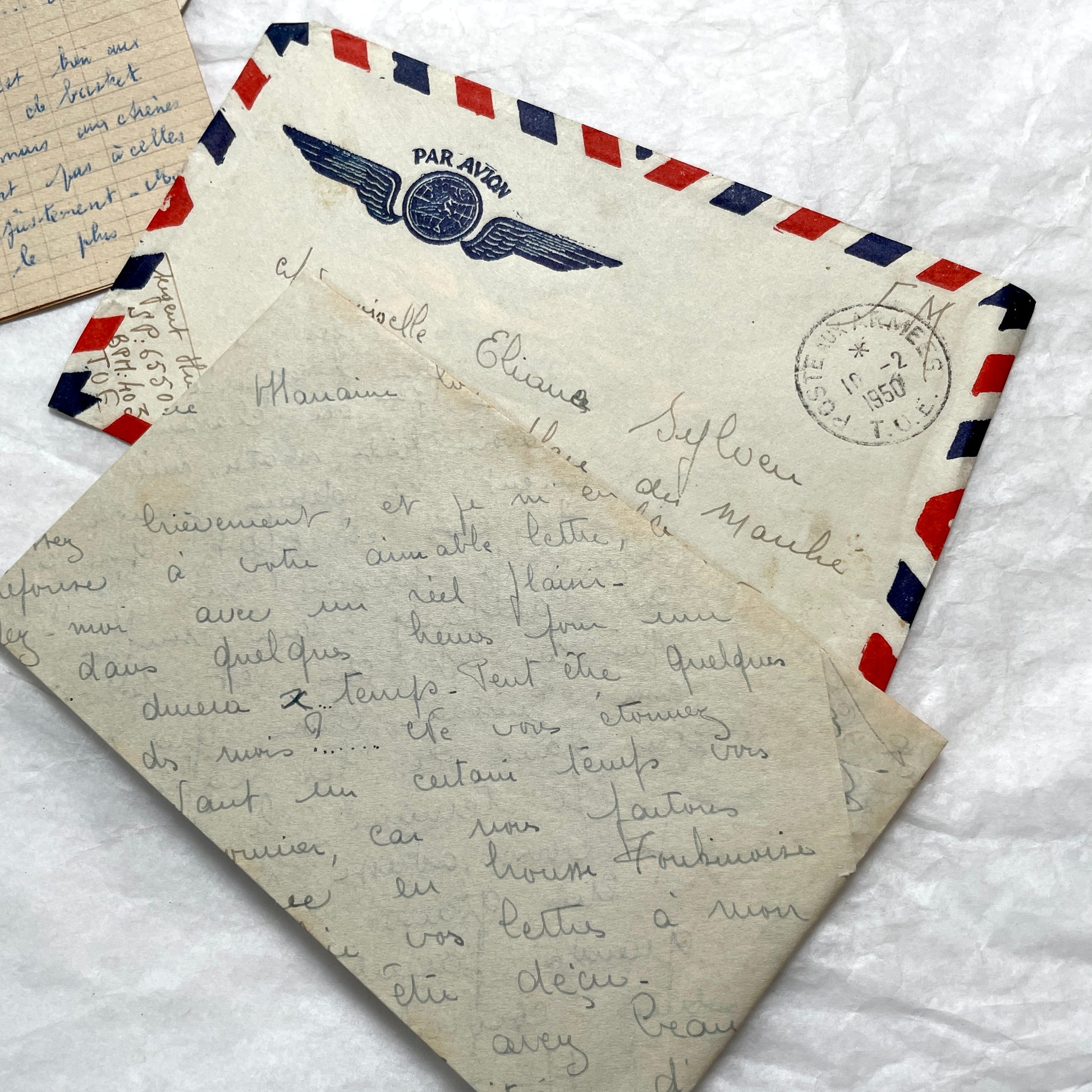 Set of 1940s French letters and envelopes, featuring handwritten notes, postal stamps, and vintage airmail details.