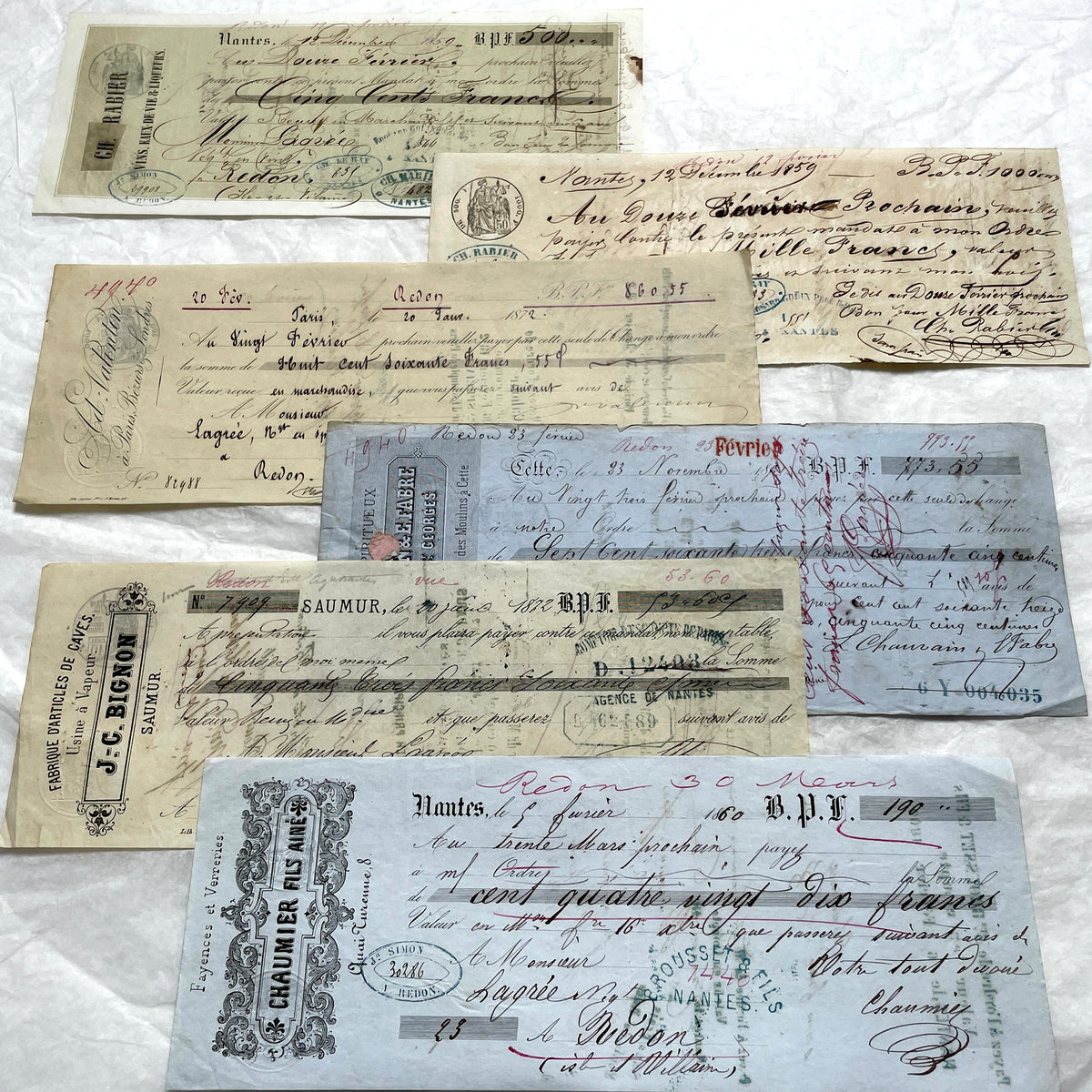 Late 19th Century French bills of exchange set, showing handwritten text, stamps, and commercial letterheads.