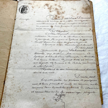 Late 19th Century French notarial marriage contract document from 1882, featuring ornate handwritten script and an official s