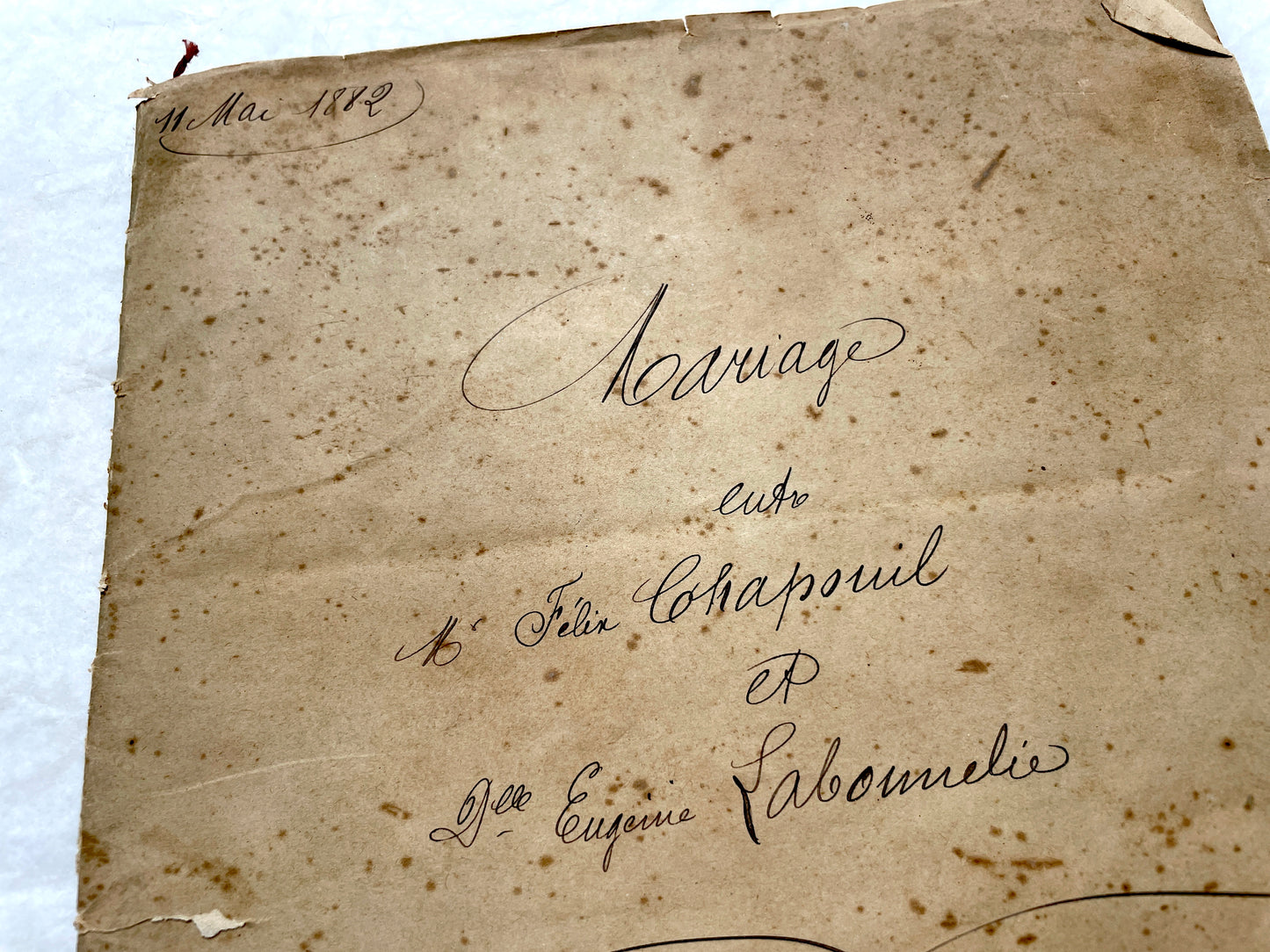 Late 19th Century French notarial marriage contract document from 1882, featuring ornate handwritten script and an official s