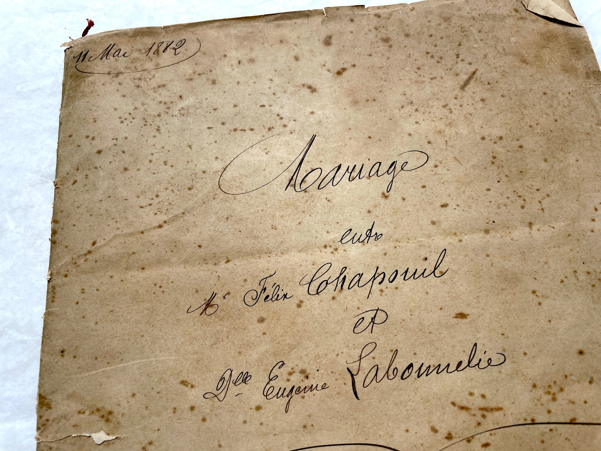 Late 19th Century French notarial marriage contract document from 1882, featuring ornate handwritten script and an official s