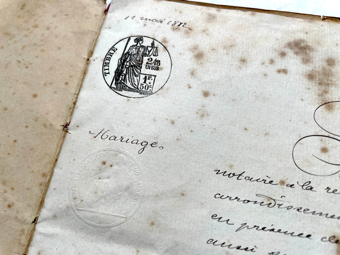 Late 19th Century French notarial marriage contract document from 1882, featuring ornate handwritten script and an official s