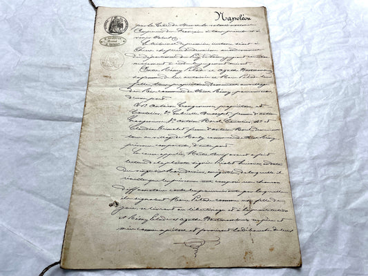 1800s French notarial act with handwritten text and imperial seals featuring a figure of justice and an eagle.