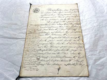 Mid 19th Century French notarial act, 1858, with elegant script and Imperial stamp featuring Justice figure.