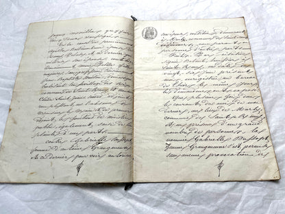 Mid 19th Century French notarial act, 1858, with elegant script and Imperial stamp featuring Justice figure.