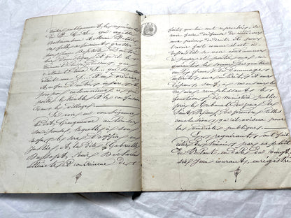 Mid 19th Century French notarial act, 1858, with elegant script and Imperial stamp featuring Justice figure.